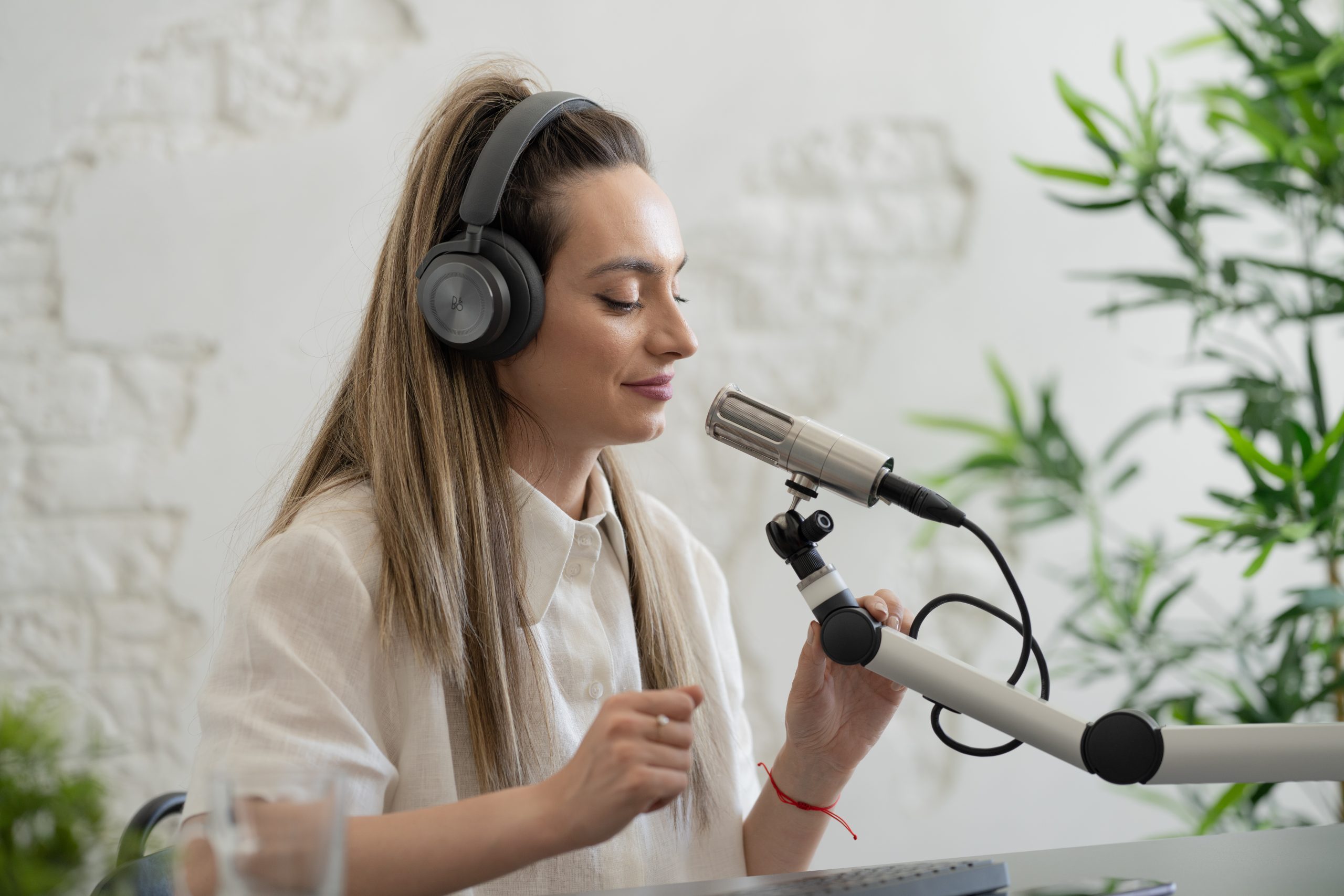 A girl with headphones using a mic