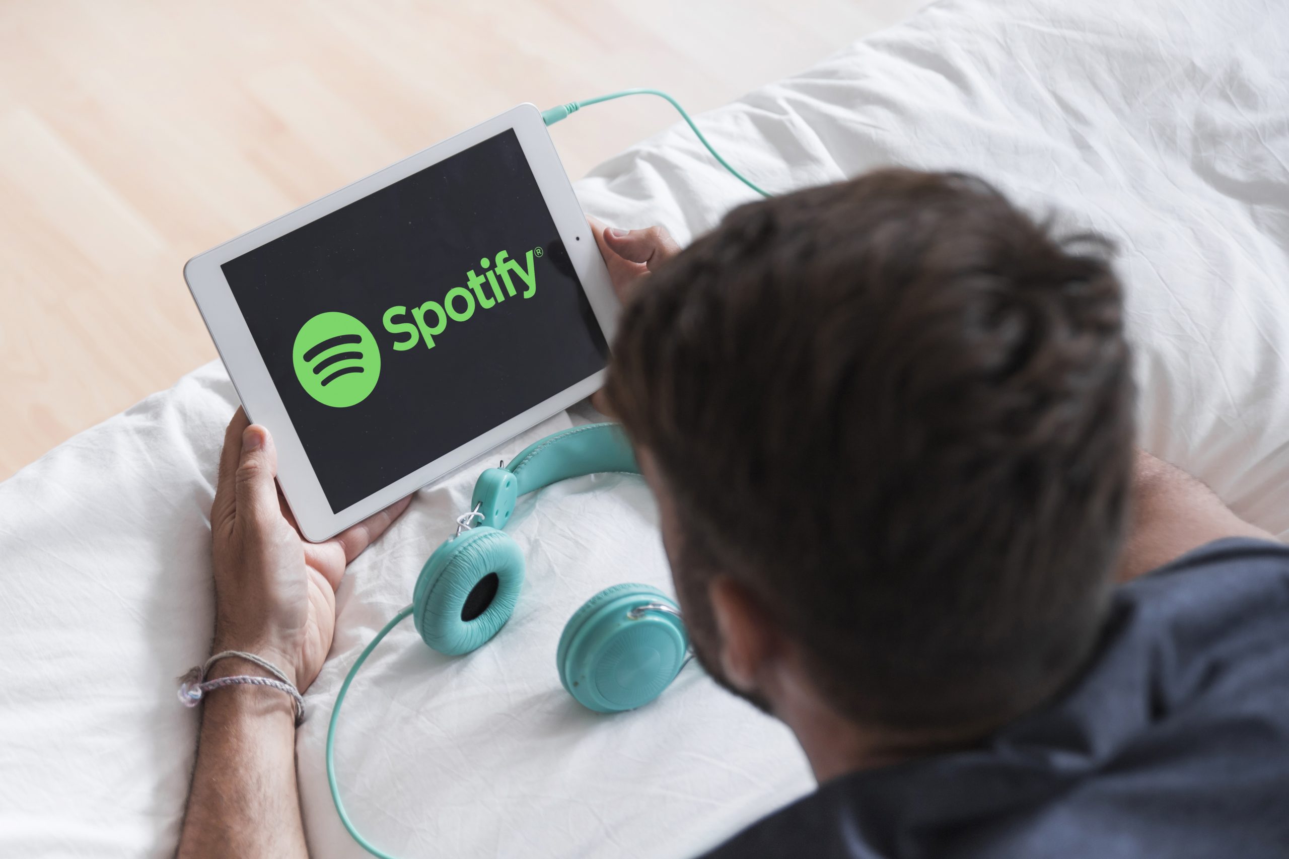 A man using Spotify on his table